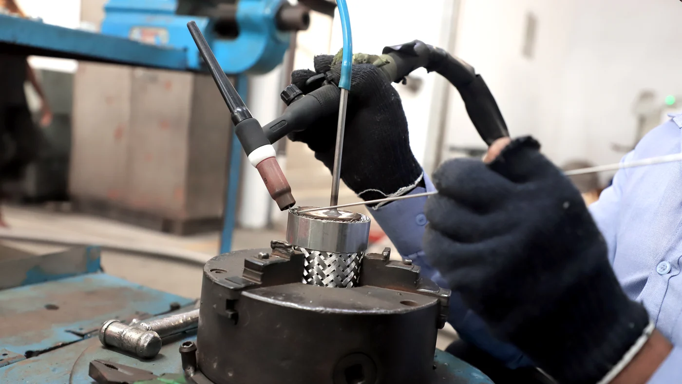 Vigyan technician doing precision assembly work - skilled craftsmanship